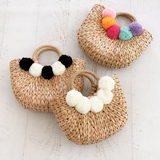 Event Blossom Crescent-Shaped Woven Straw Purse with Pom Poms